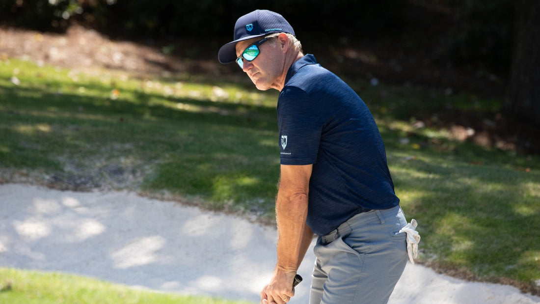 Dan Jansen focuses on a golf shot during his charity event.