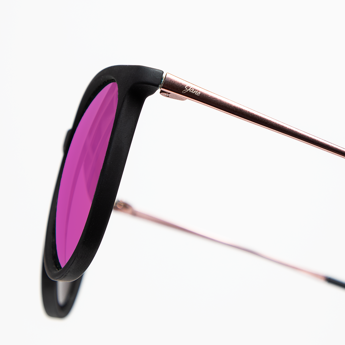 Stylish black round sunglasses with pink mirrored lenses and rose gold detailing from Jane Legacy