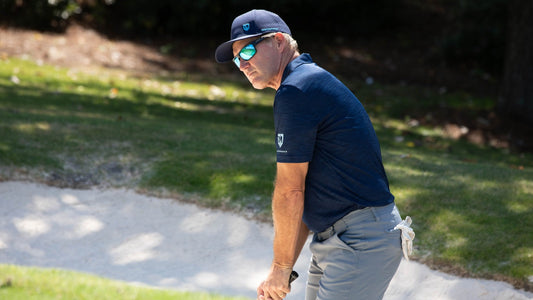 Dan Jansen focuses on a golf shot during his charity event.
