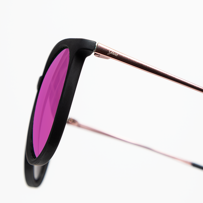 Stylish black round sunglasses with pink mirrored lenses and rose gold detailing from Jane Legacy